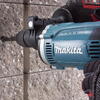 Masina de gaurit si insurubat (bormasina) cu percutie Makita HP1631K, 710 W, 3200 RPM, 48.000 percutii/min, 13 mm mandrina, maner lateral, valiza transport
